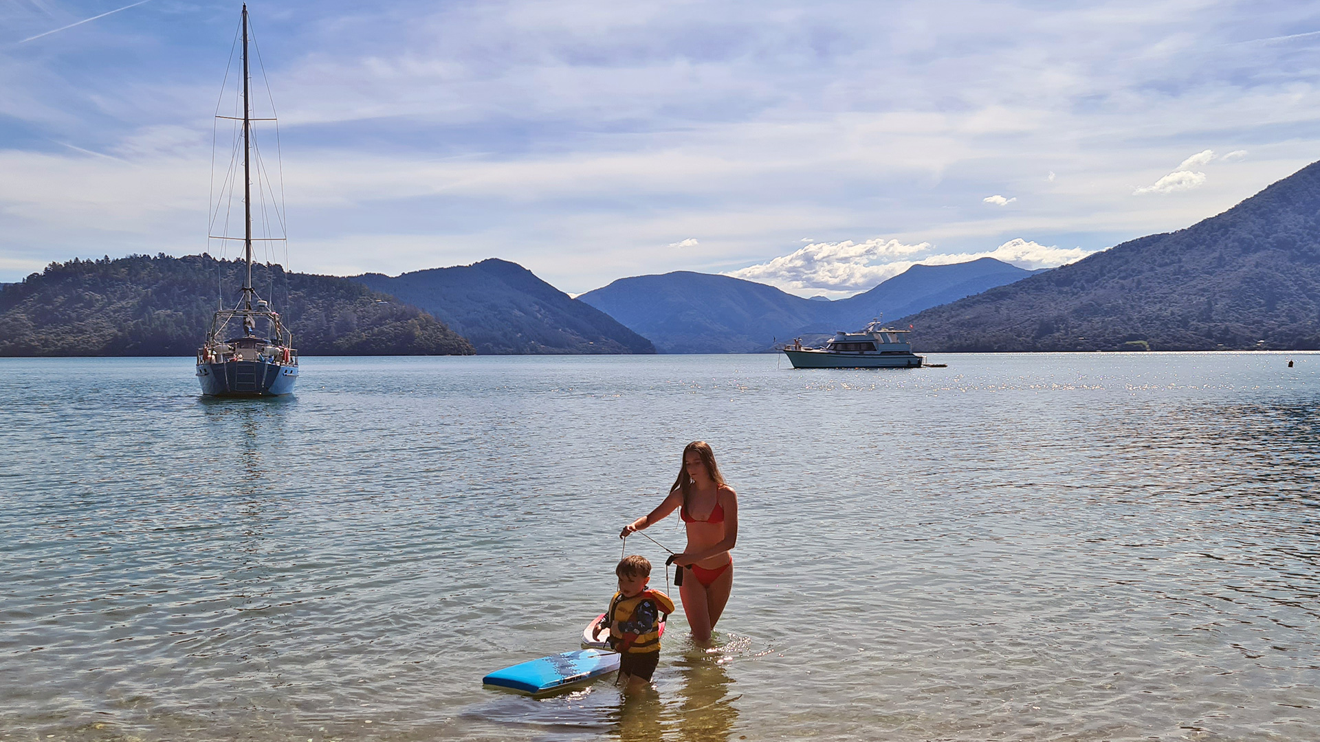 Fun at Double Beach boat moored in Marlborough Sounds