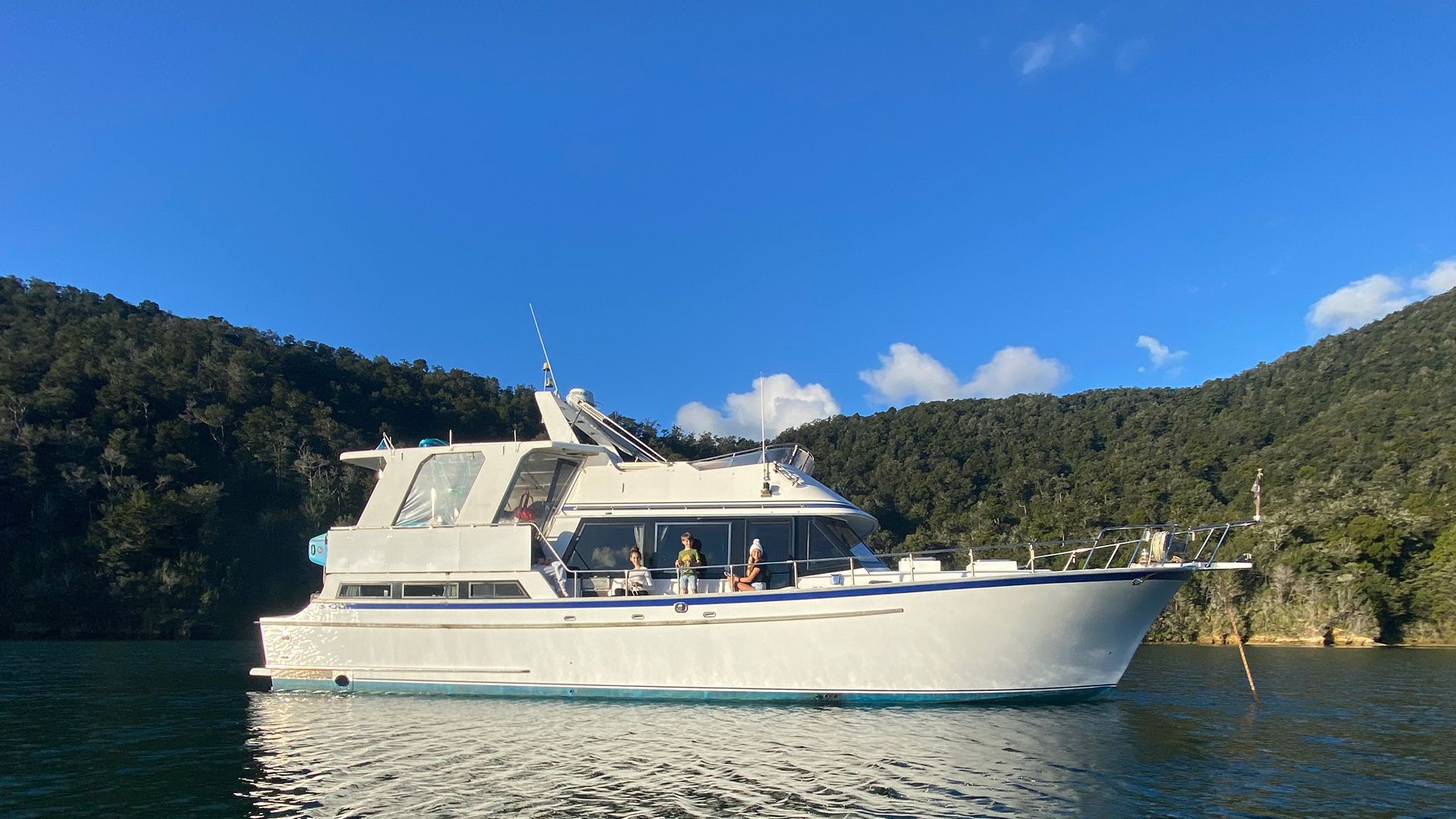 knot nauti boat oriental lady at anchor