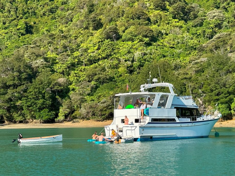 Boat at anchor with family having fun